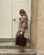 Sienna deep brown suede top handle bag styled with an oversized blazer and trousers