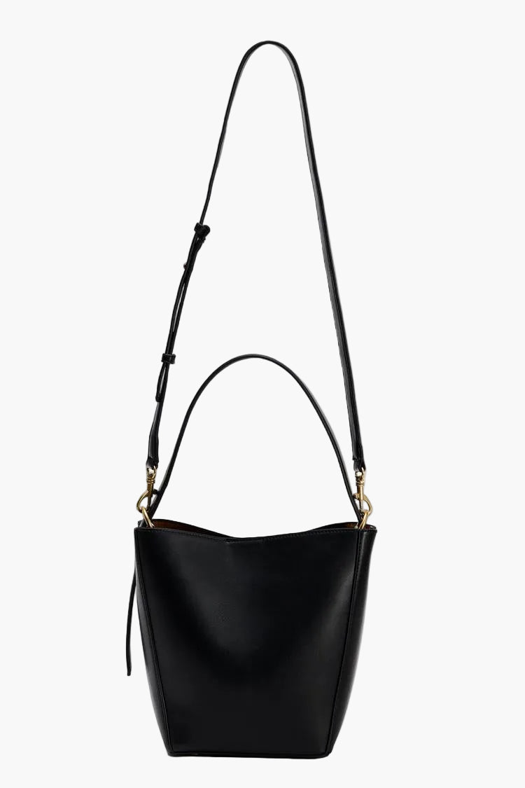 black bucket bag with a long crossbody strap and short handle