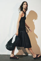 women carrying black fringe tote bag shoulder street style
