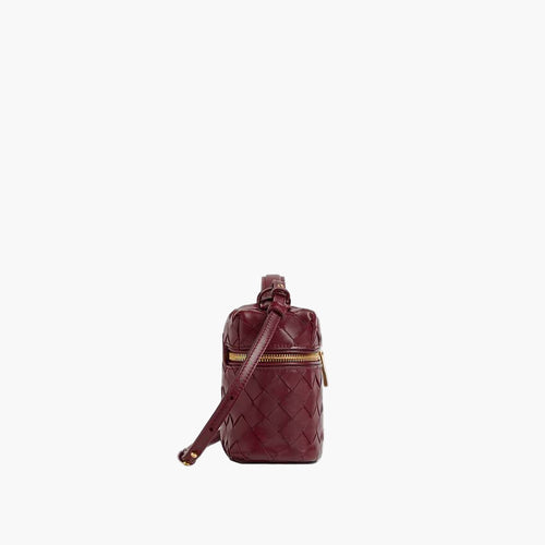 woven mini crossbody bag burgundy side view women gold zip hardware