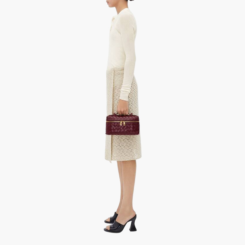 women carrying woven mini bag crossbody street style close up