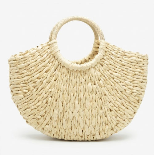 cream crescent straw bag front view with round handles