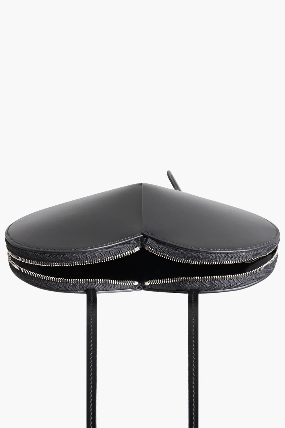 heart shaped bag black flat lay women sculptural