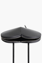 heart shaped bag black flat lay women sculptural