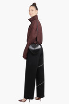 women wearing black heart shaped bag crossbody street style elegant