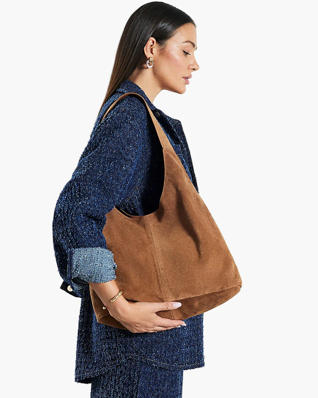 women carrying brown suede hobo tote bag shoulder street style