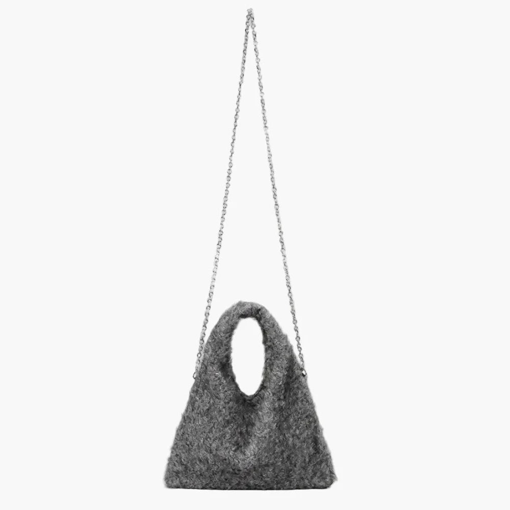 Cozy fuzzy handbag close-up texture detail.long strap 