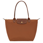 Le Pliage Medium Tote Bag in cognac brown with long shoulder handles and gold-tone hardware