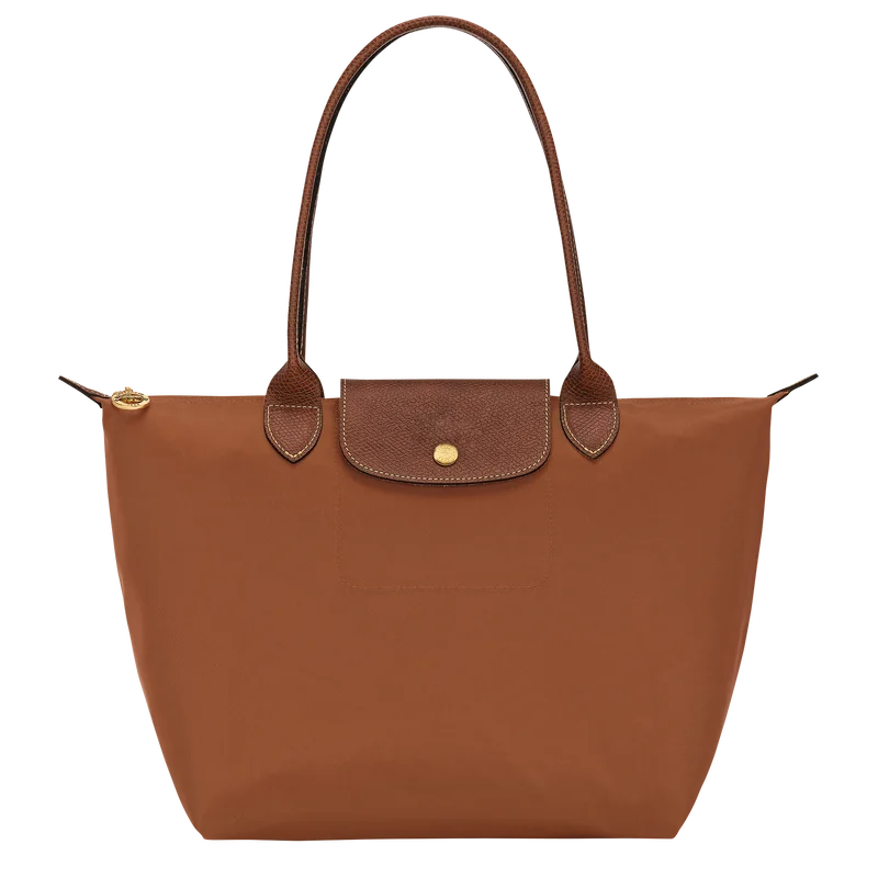 Le Pliage Medium Tote Bag in cognac brown with long shoulder handles and gold-tone hardware