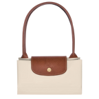Le Pliage Medium Tote Bag in Paper folded into a compact size for travel and storage