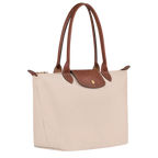 Le Pliage Medium Tote Bag in Paper side view showing brown trim and lightweight foldable design