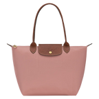 Le Pliage Medium Tote Bag in dusty pink with brown shoulder handles and gold-tone hardware