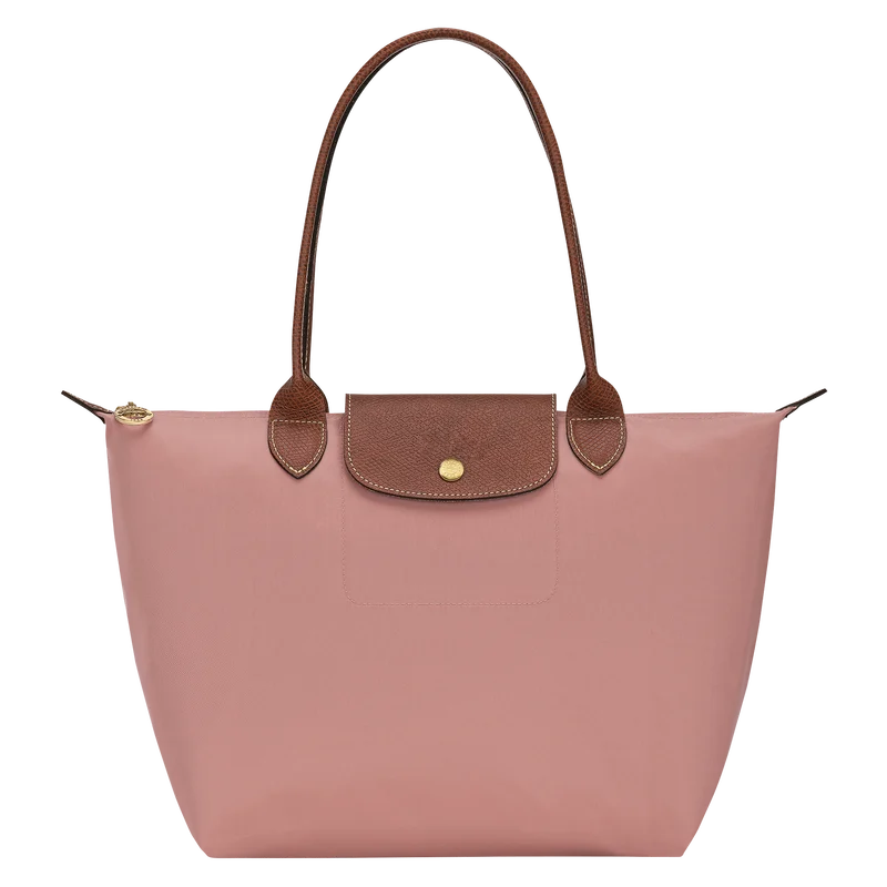 Le Pliage Medium Tote Bag in dusty pink with brown shoulder handles and gold-tone hardware