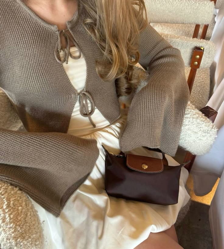 Le Pliage Mini Pouch in Mocha worn crossbody with a neutral outfit