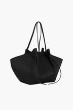 knotted tote bag black side view women structured