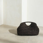 brown crochet clutch bag lifestyle minimal interior setting - brown - clutch bag