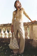 woman carrying cream macrame stone bead tote bag outdoor summer editorial - cream - tote bag