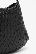 black woven shoulder bag side close up detail