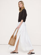 woman carrying wooden bead tote bag summer outfit natural tan - tan - tote bag