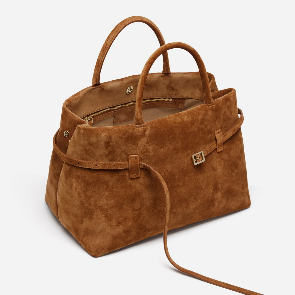Sienna camel suede top handle bag side view with belted detail and structured silhouette
