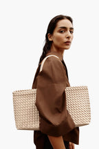 women wearing woven tote bag ecru cream street style elegant